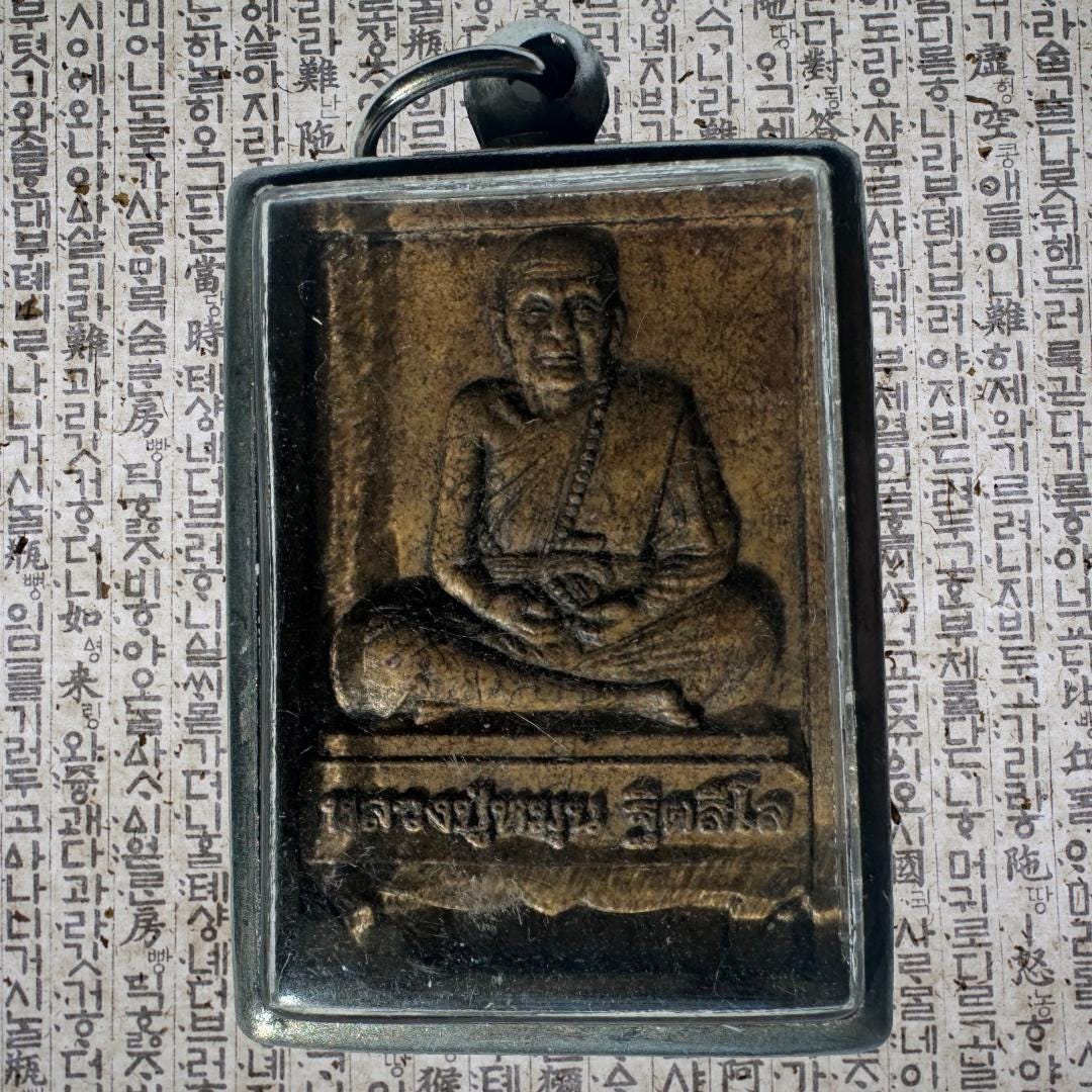 Luang Phor Tuad Amulet: Silver Case, Yantra Script | Protection and Blessings | Metta-Blessed™
